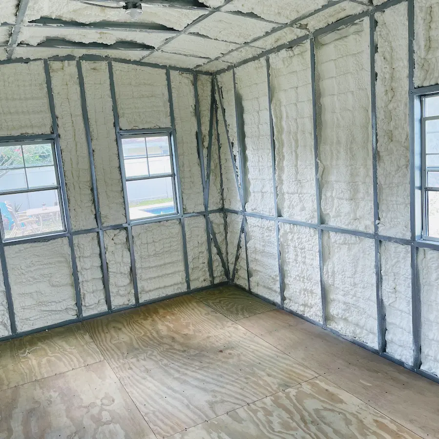 Closed-cell spray foam insulation applied to wall cavities in a residential project in Prospect Heights